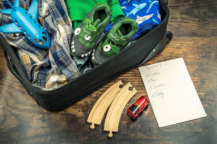 Travel clothing laid out for packing