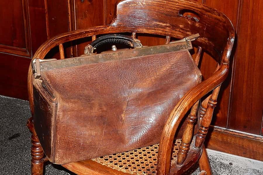 A canvas kit bag on a wooden floor