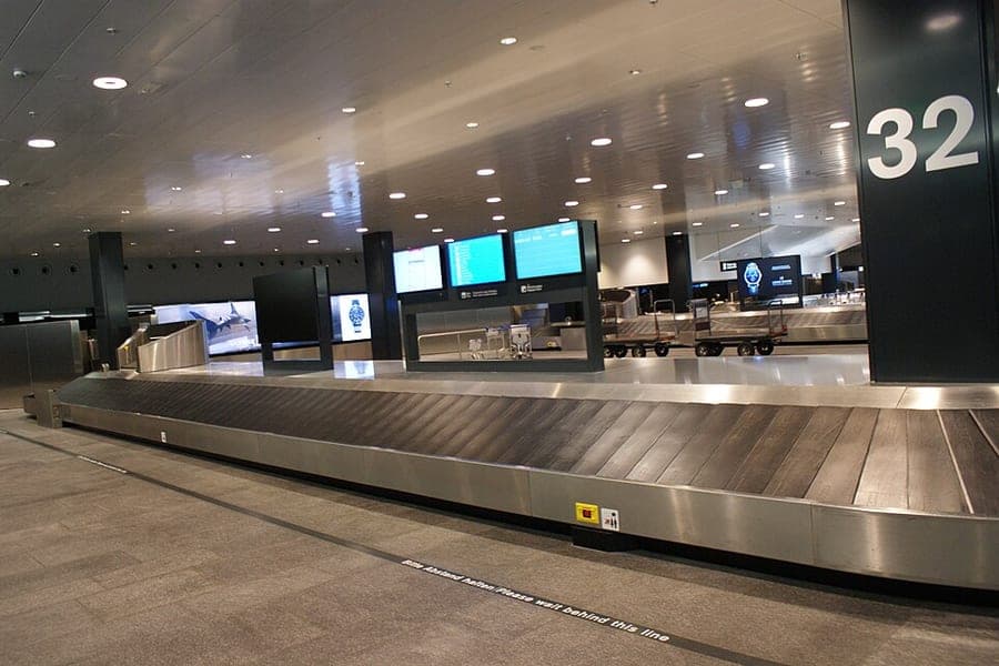 Baggage moving along a conveyor at an airport baggage claim