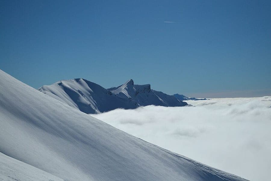 A snow-covered mountain landscape in winter
