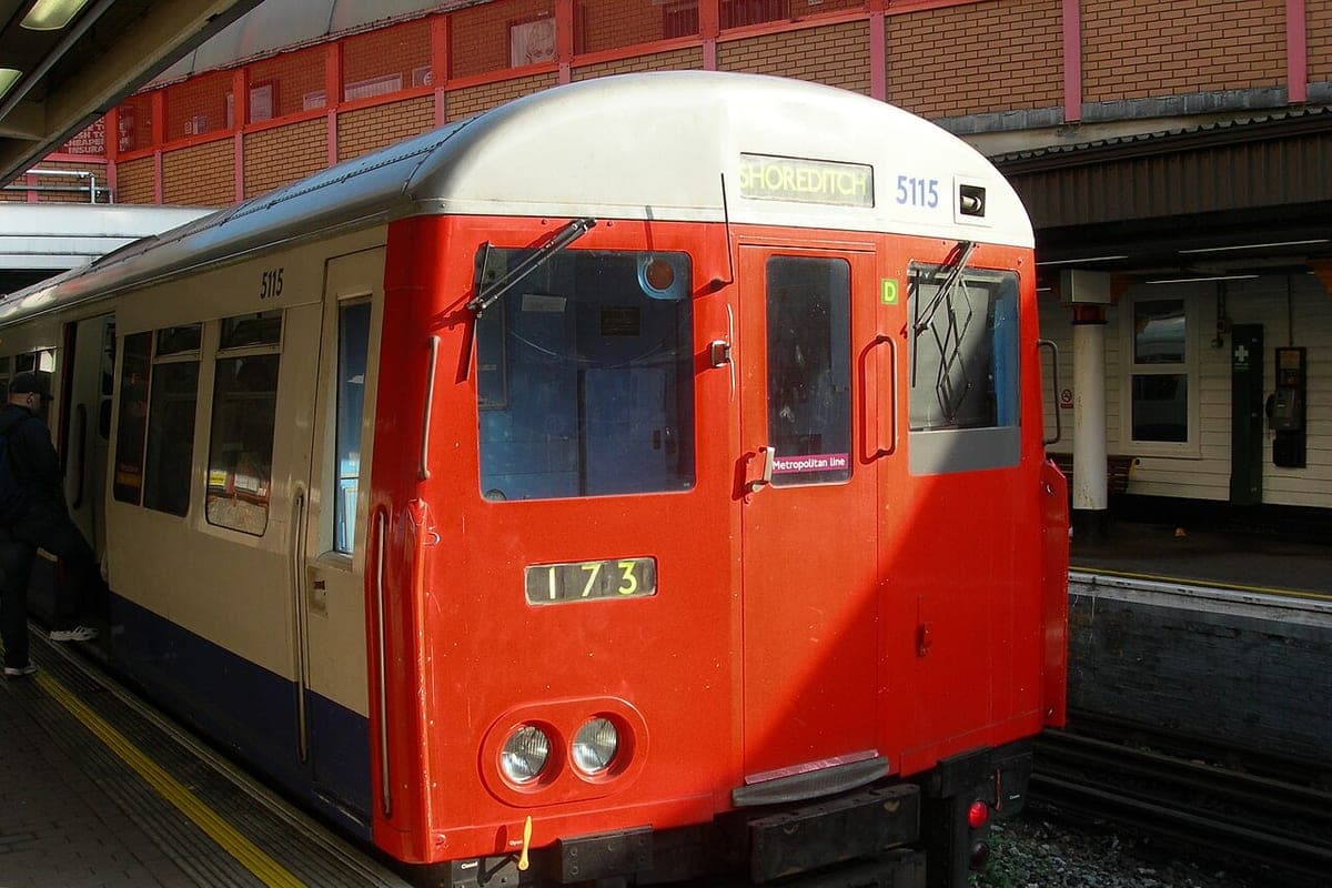 A London Underground train waiting at a platform