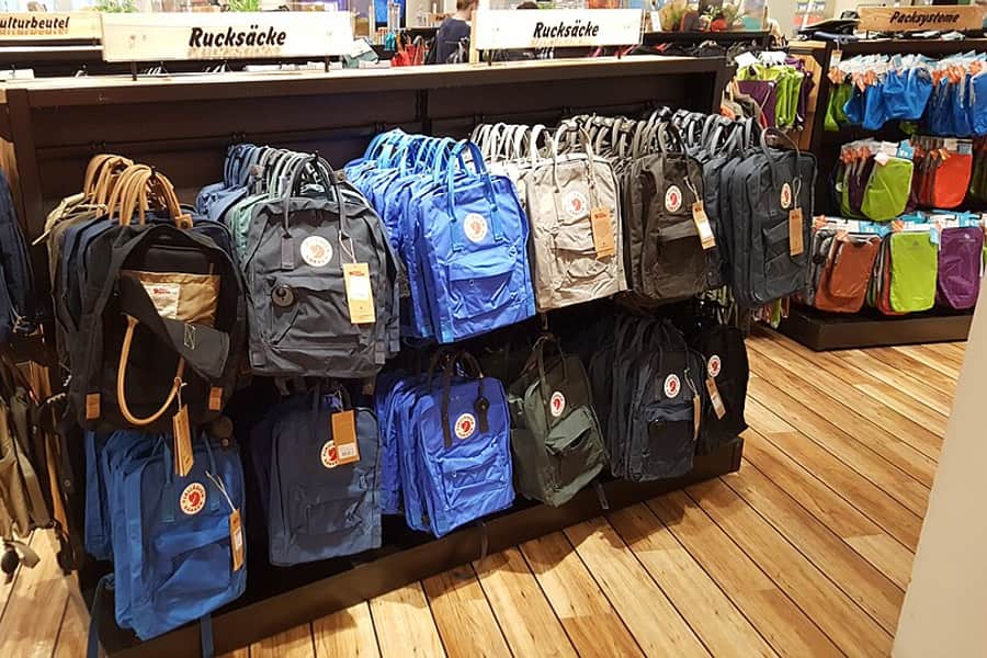 Backpacks displayed on a shop rail