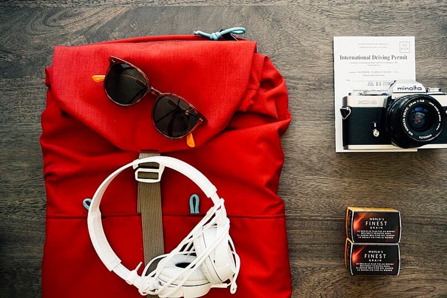 Clothes and travel items laid out ready to pack
