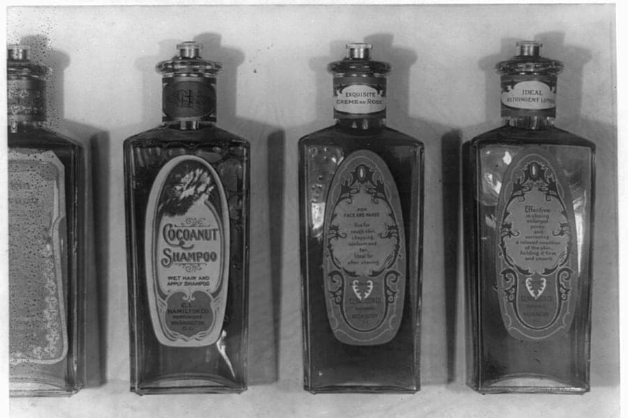 Bottles of shampoo and lotion on a shelf