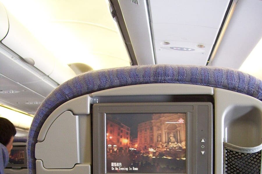 Economy class seats in an aircraft cabin
