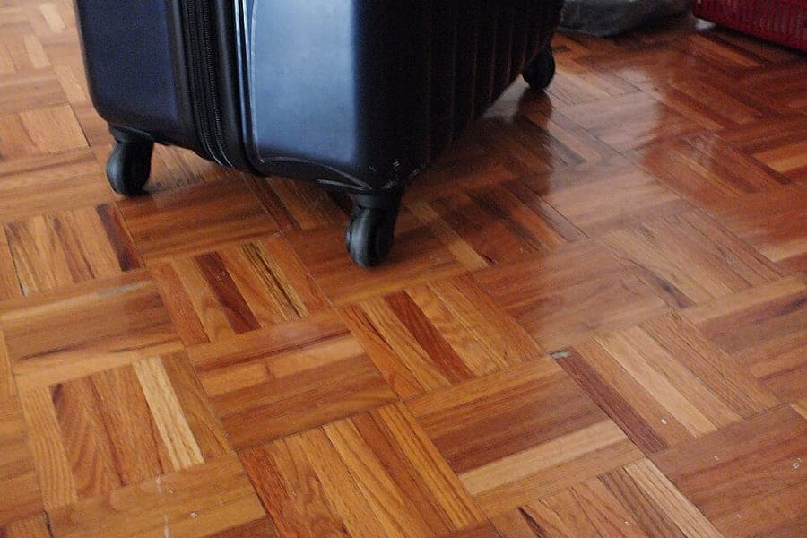 Spinner wheels on the base of a hardside suitcase