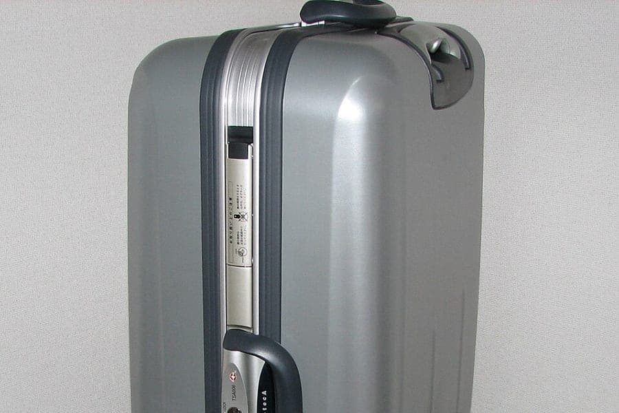 A wheeled suitcase standing upright