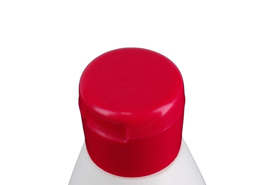 A plastic shampoo bottle
