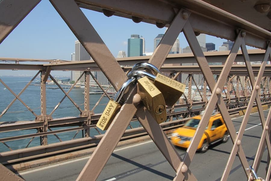 A padlock closed on a metal fitting